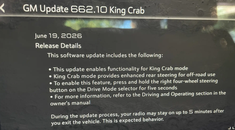 In-vehicle screen showing GM Update 662.10 King Crab release notes, listing what the update enables, how to activate the feature, where to find more information, and a note that the radio may stay on briefly after exiting the vehicle